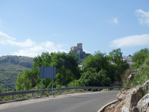 Another Castle or Rook stands alone on a hilltop.